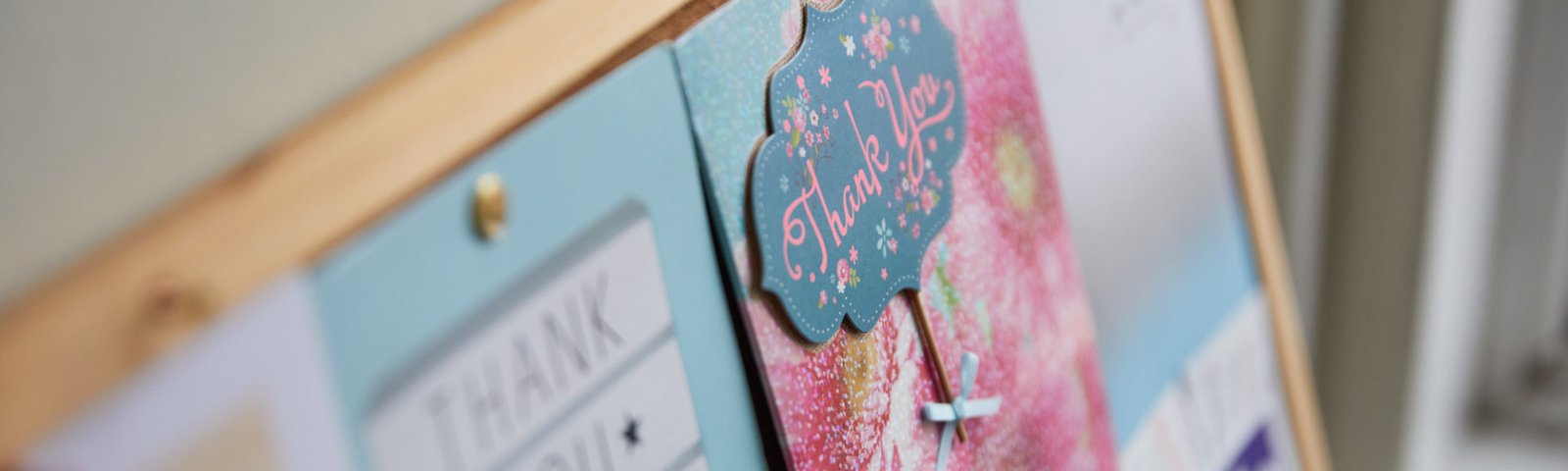 A photo showing a pin board full of thankyou cards
